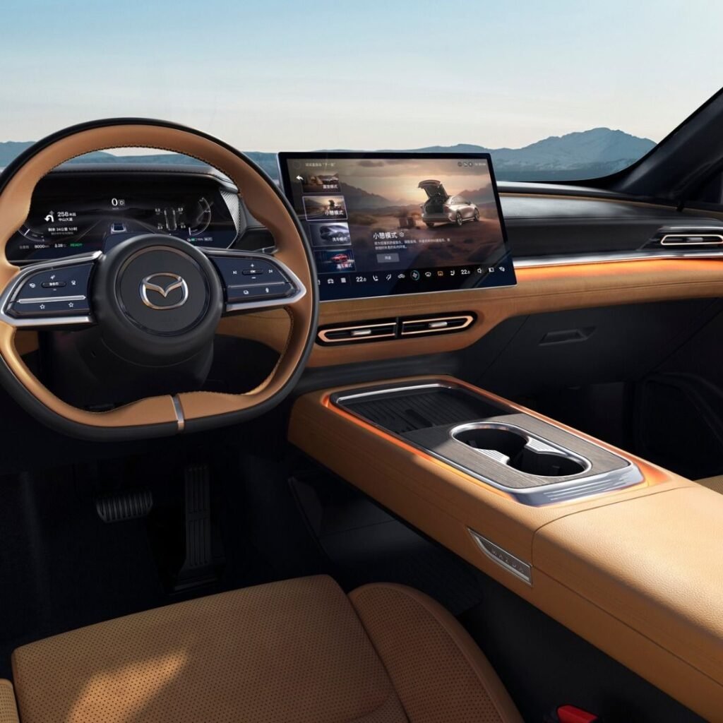 Mazda EZ-6 interior dashboard and screen showing how do hybrid cars work while driving